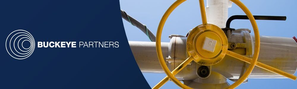 Image of Buckeye Partners logo on left in white over a dark blue background, and a yellow turn handle on right